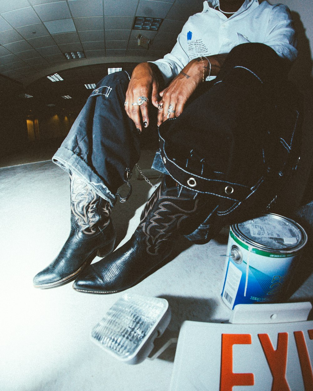 a man sitting on the floor with his feet up