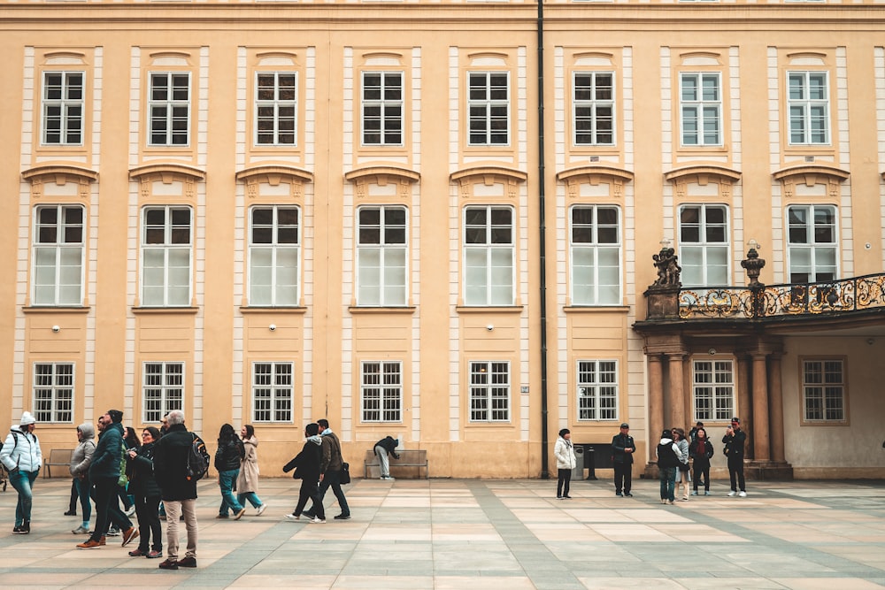 a group of people standing in front of a building