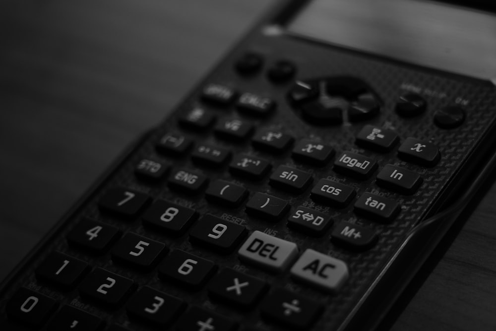 a close up of a remote control on a table