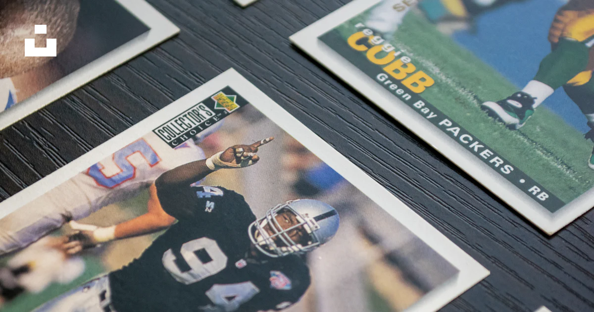 A table topped with lots of different sports cards photo – Free Upper ...