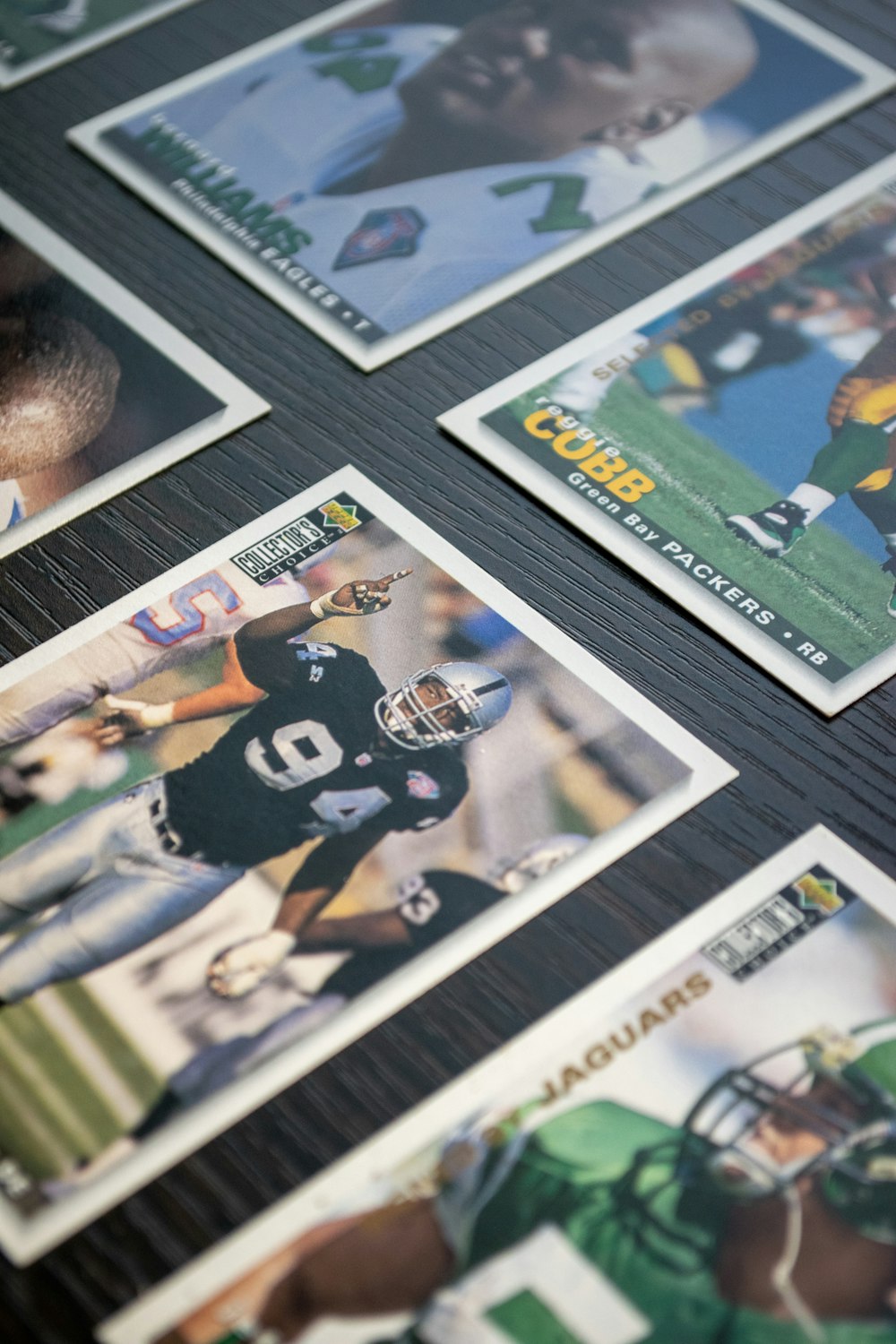 a table topped with lots of different sports cards