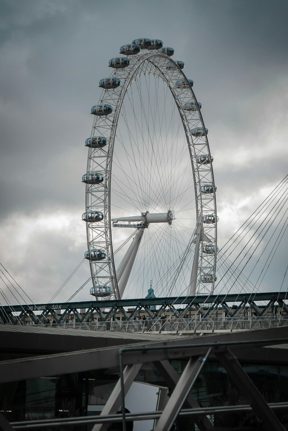 a large ferris wheel on a cloudy day