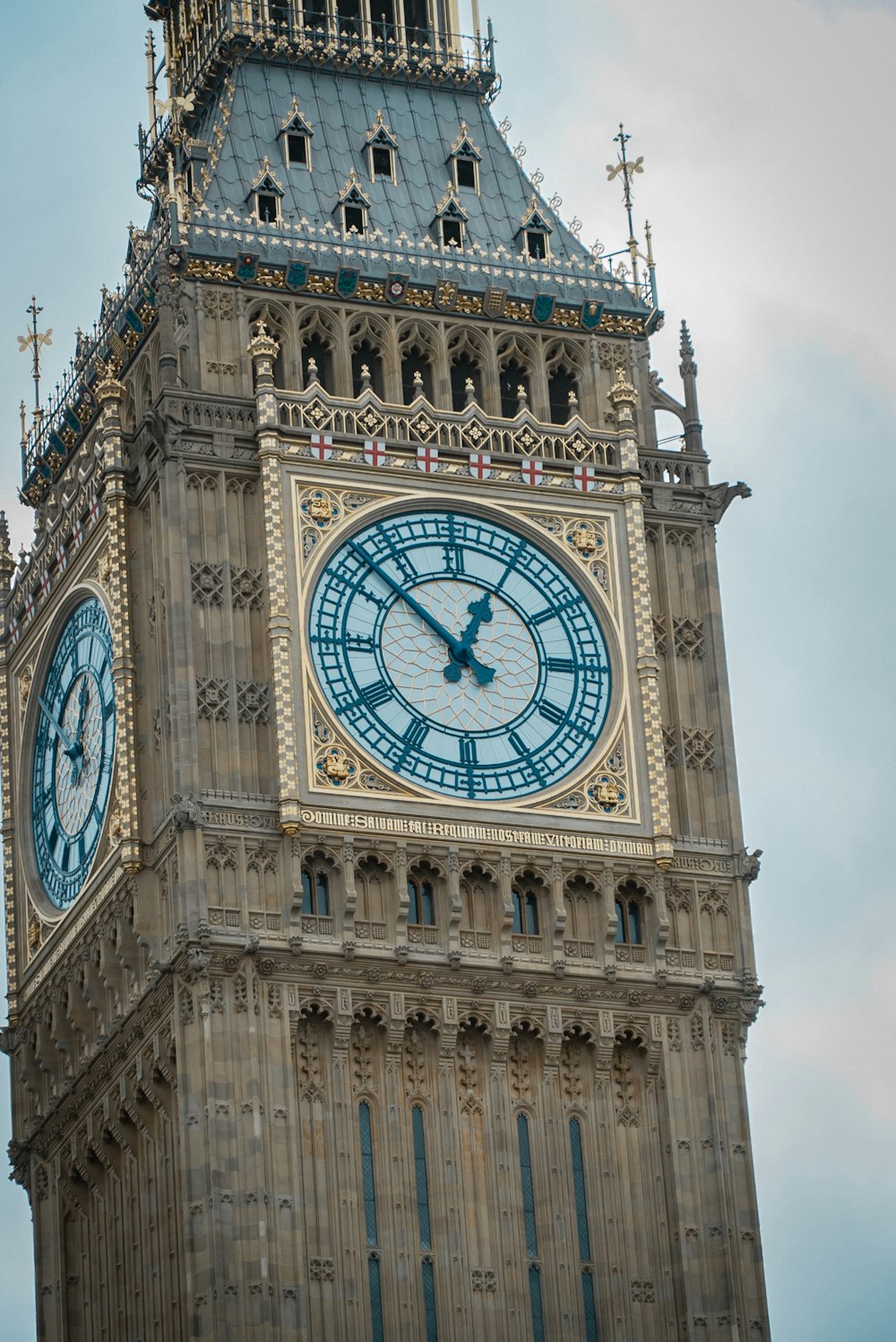 a large clock tower with a sky background