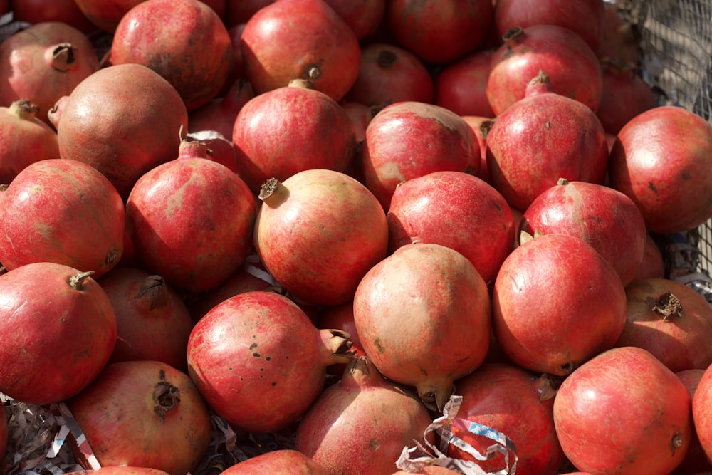 a pile of pomegranates sitting on top of each other