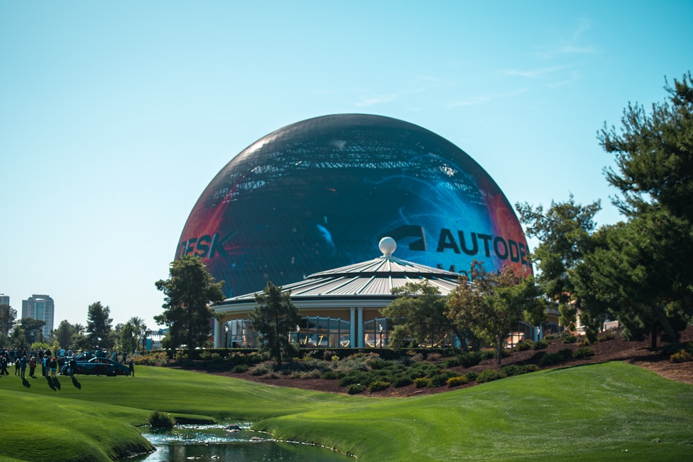 a golf course with a large building in the background