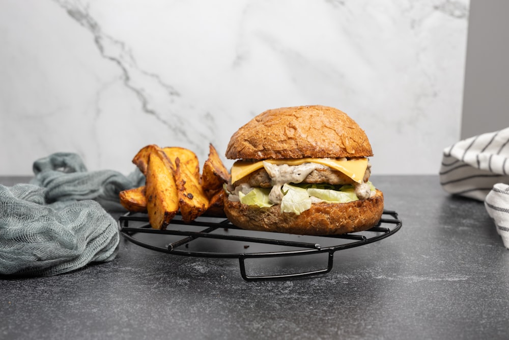 a hamburger and some fries on a table