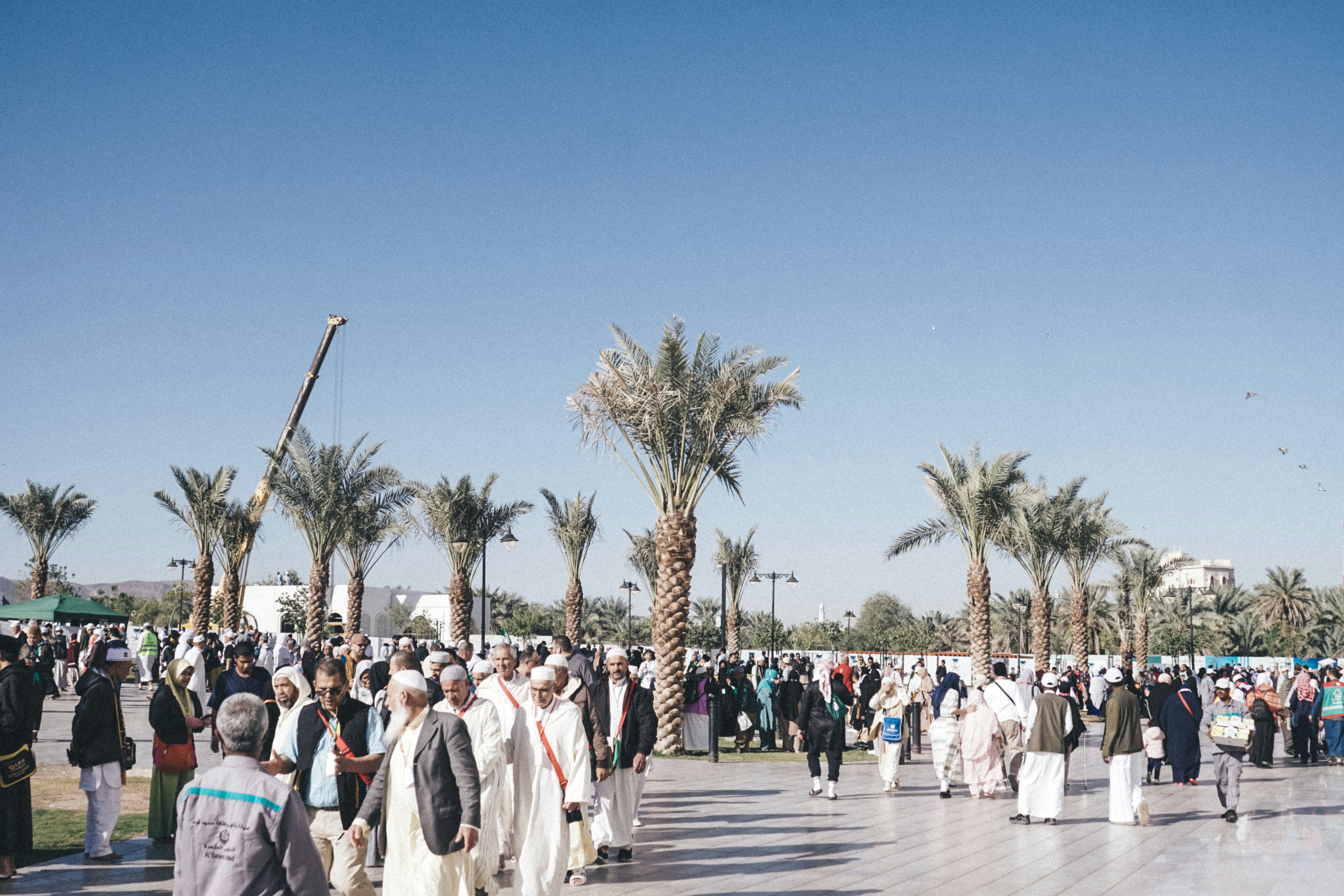 a large group of people standing in a courtyard