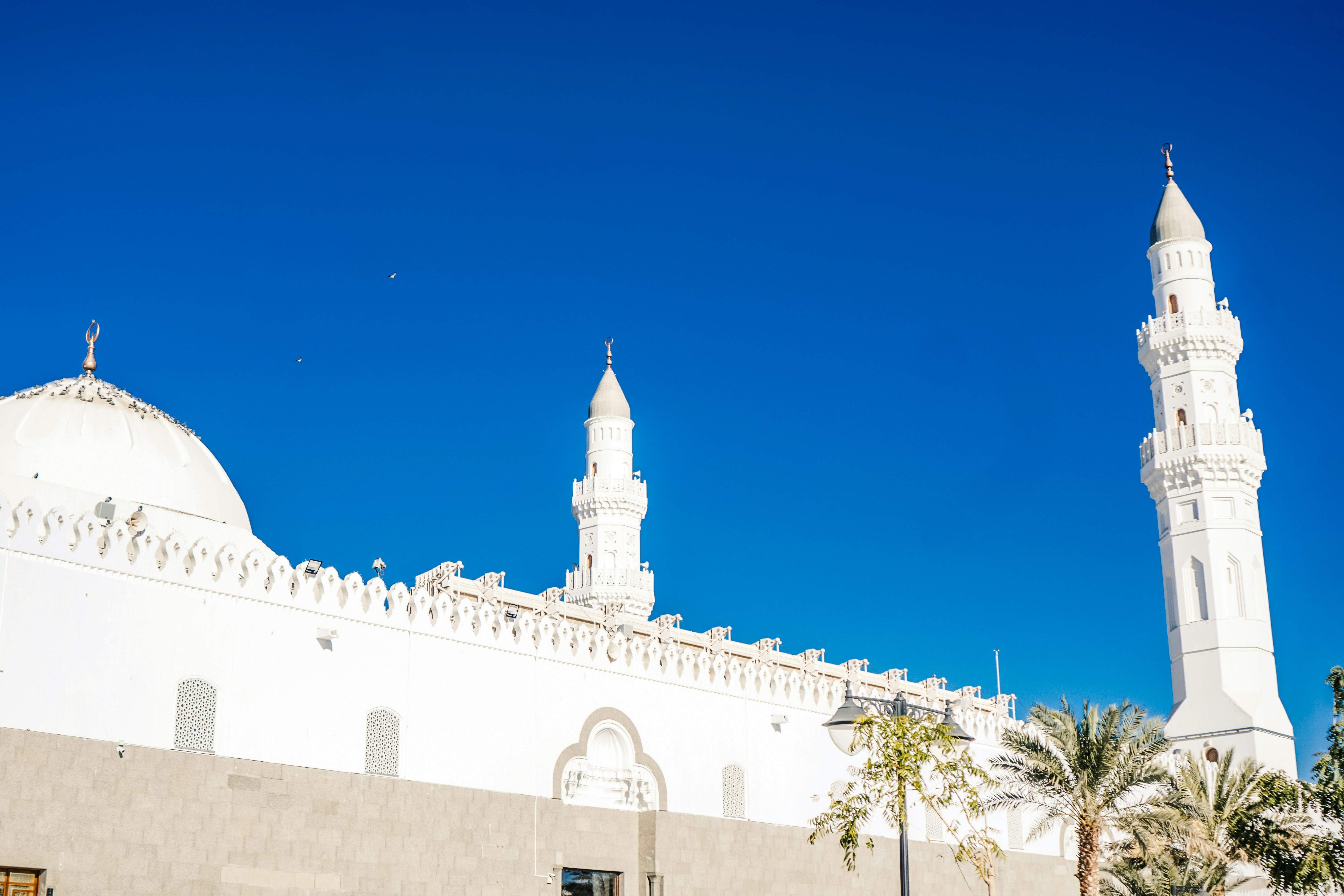 a large white building with a tall white tower