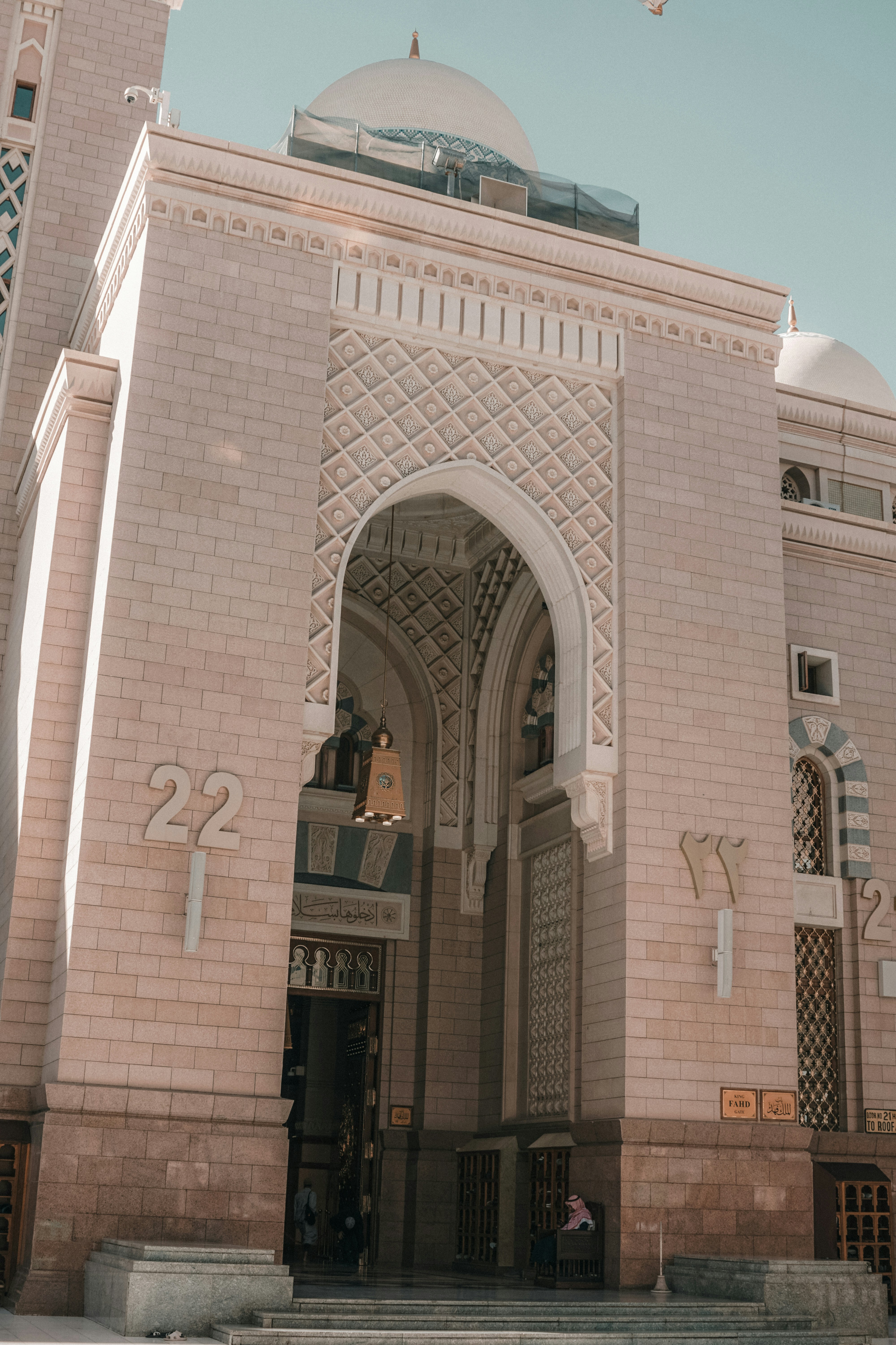 a large white building with a clock on it's side