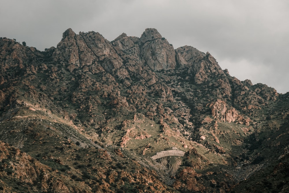 a very tall mountain with a road going through it