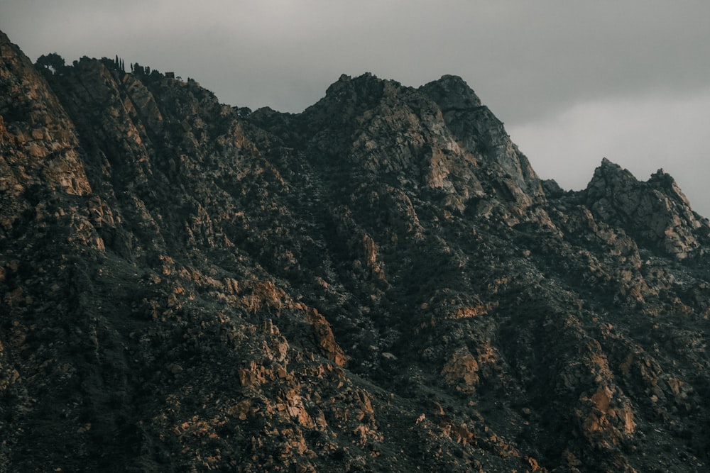 a very tall mountain with a cloudy sky