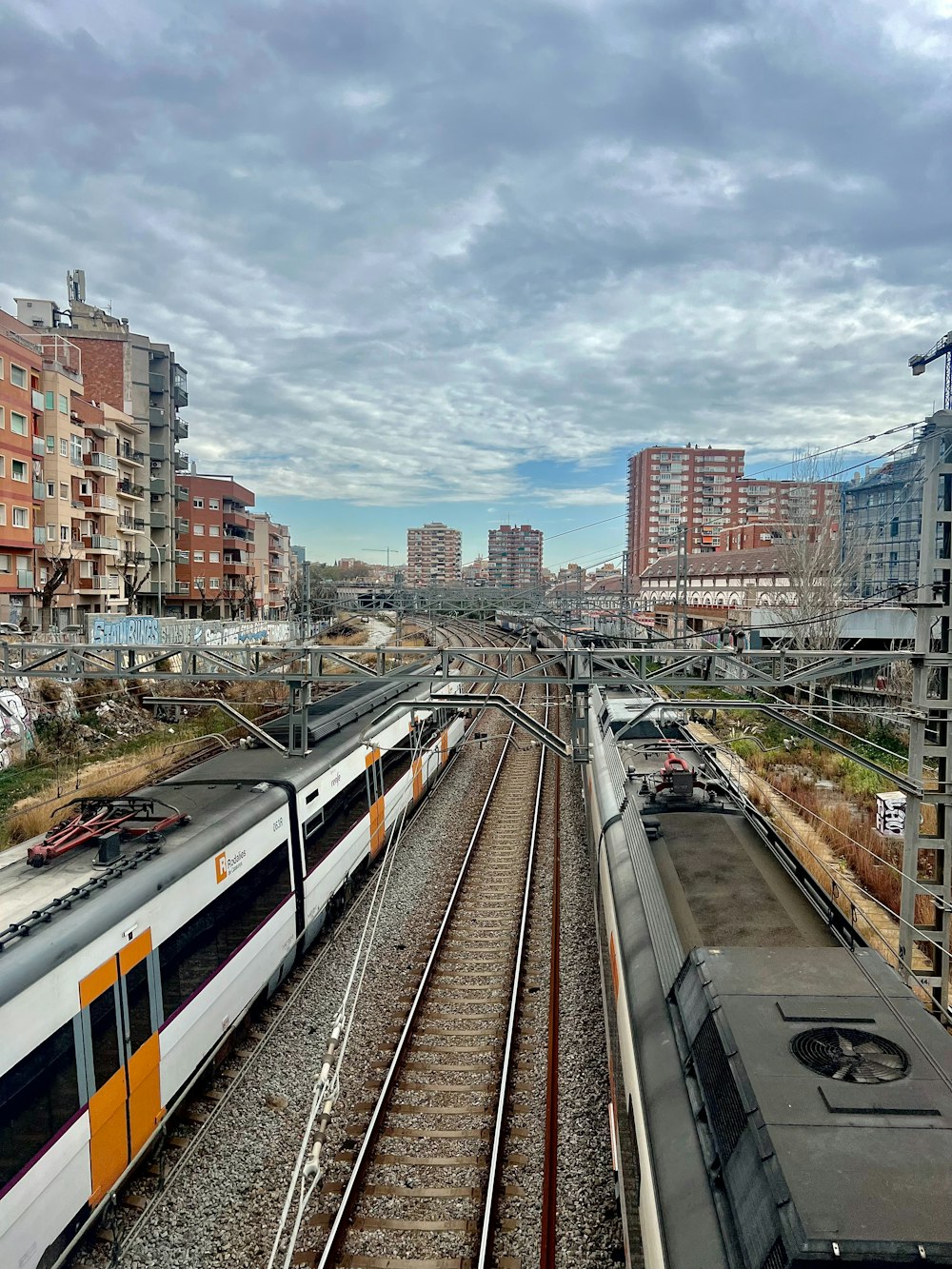 a couple of trains that are sitting on the tracks