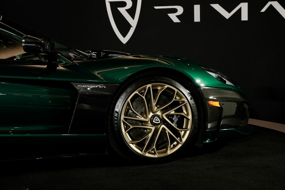 a close up of a green sports car on display