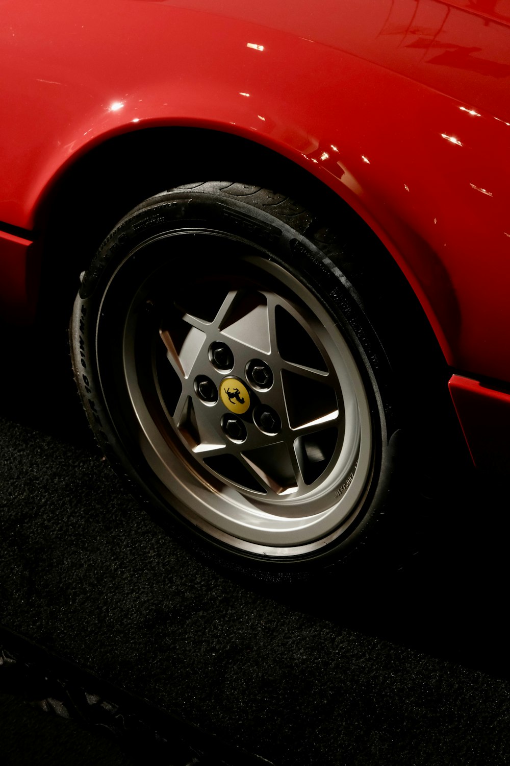 a red sports car parked in a parking lot