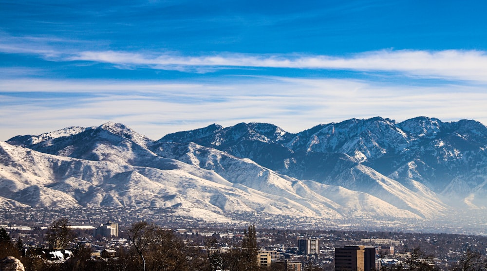 a view of a city with mountains in the background