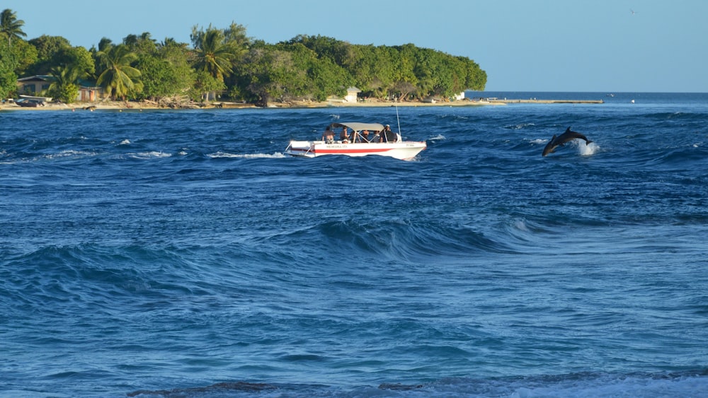 a small boat in the middle of a large body of water