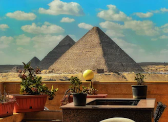 a view of the pyramids of giza from a balcony