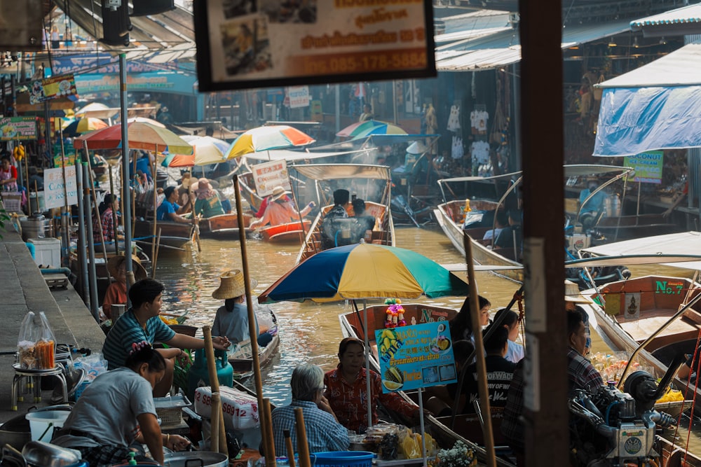 a group of people on boats in a body of water