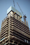 a tall building with a crane on top of it