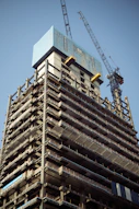 a tall building with a crane on top of it