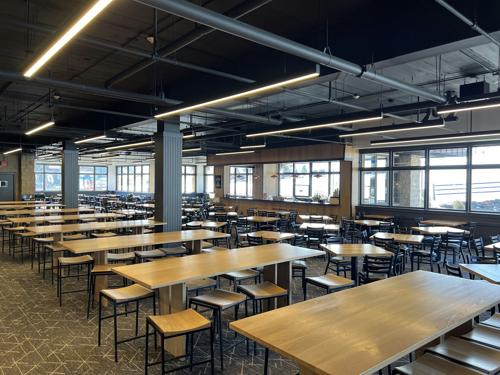 School dining hall with long tables on a resilient floor