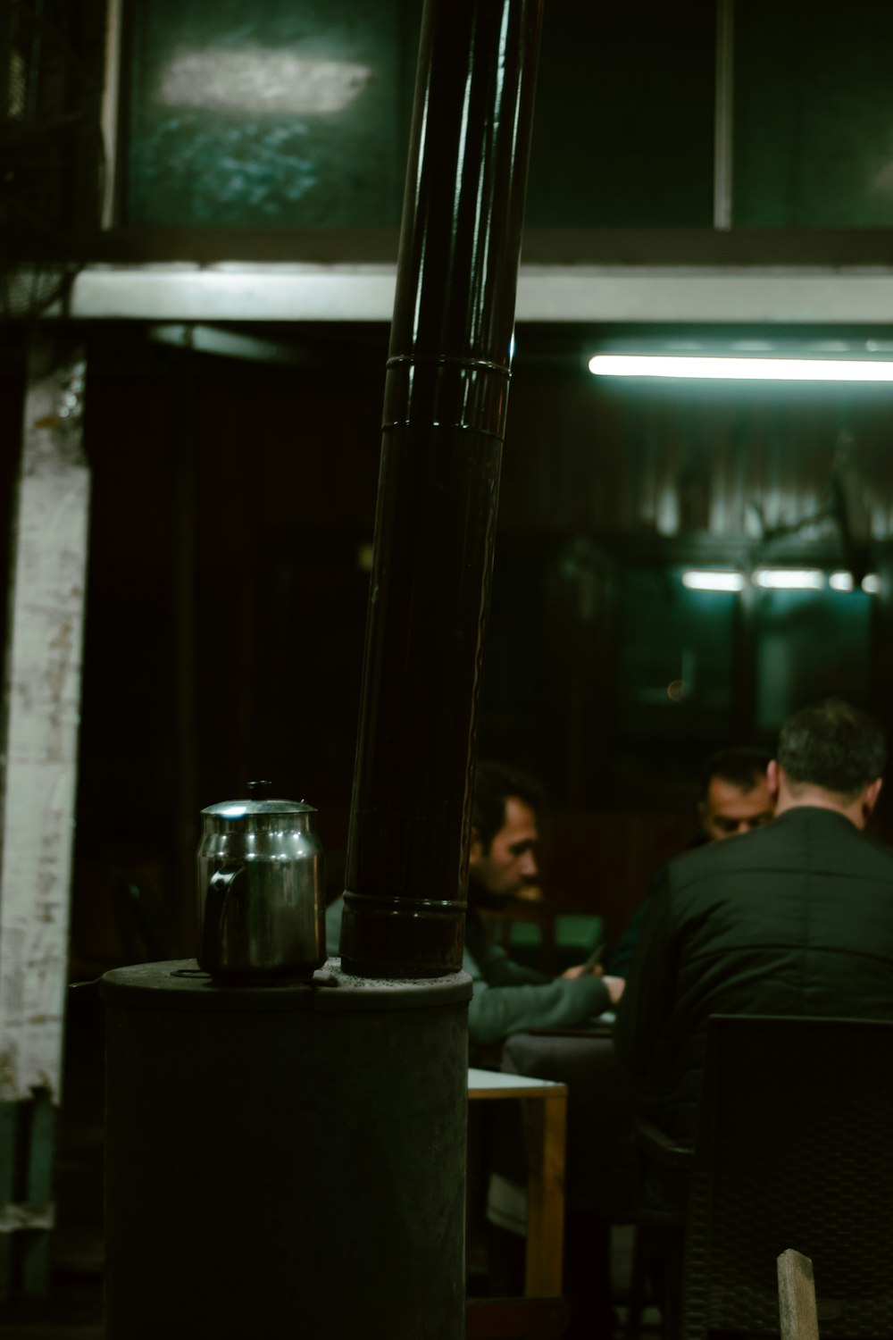 a group of people sitting around a table