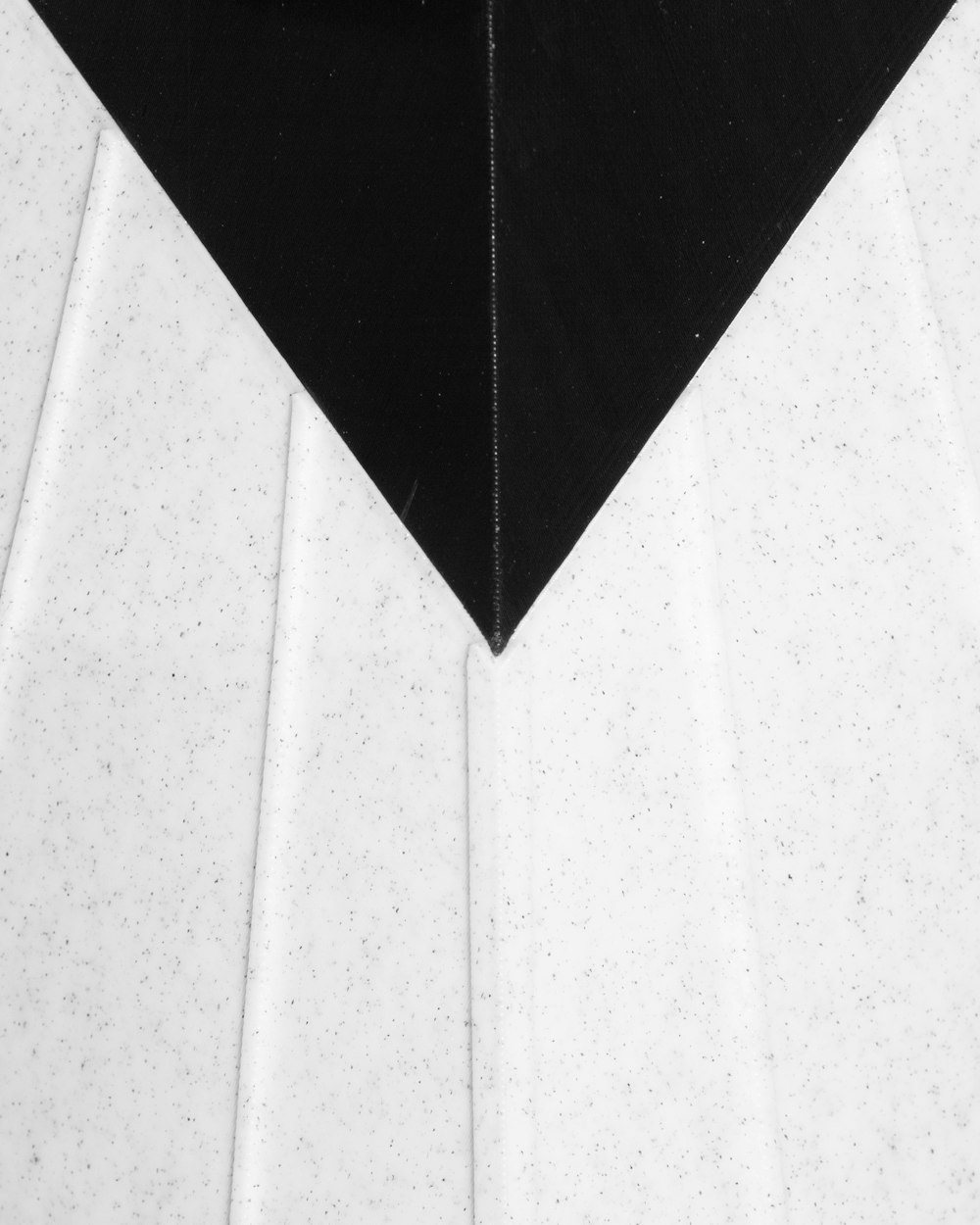 a black and white photo of a black and white triangle