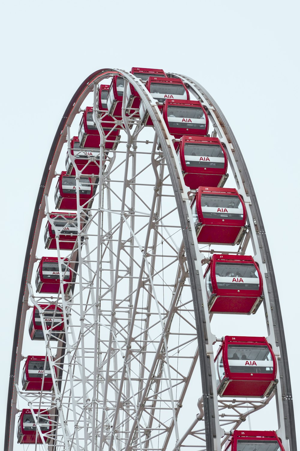 a ferris wheel with red seats on top of it