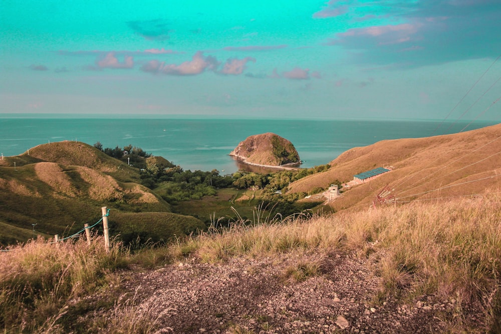 a view of the ocean from the top of a hill