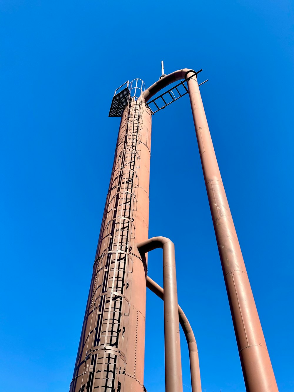 a tall metal structure with a sky background