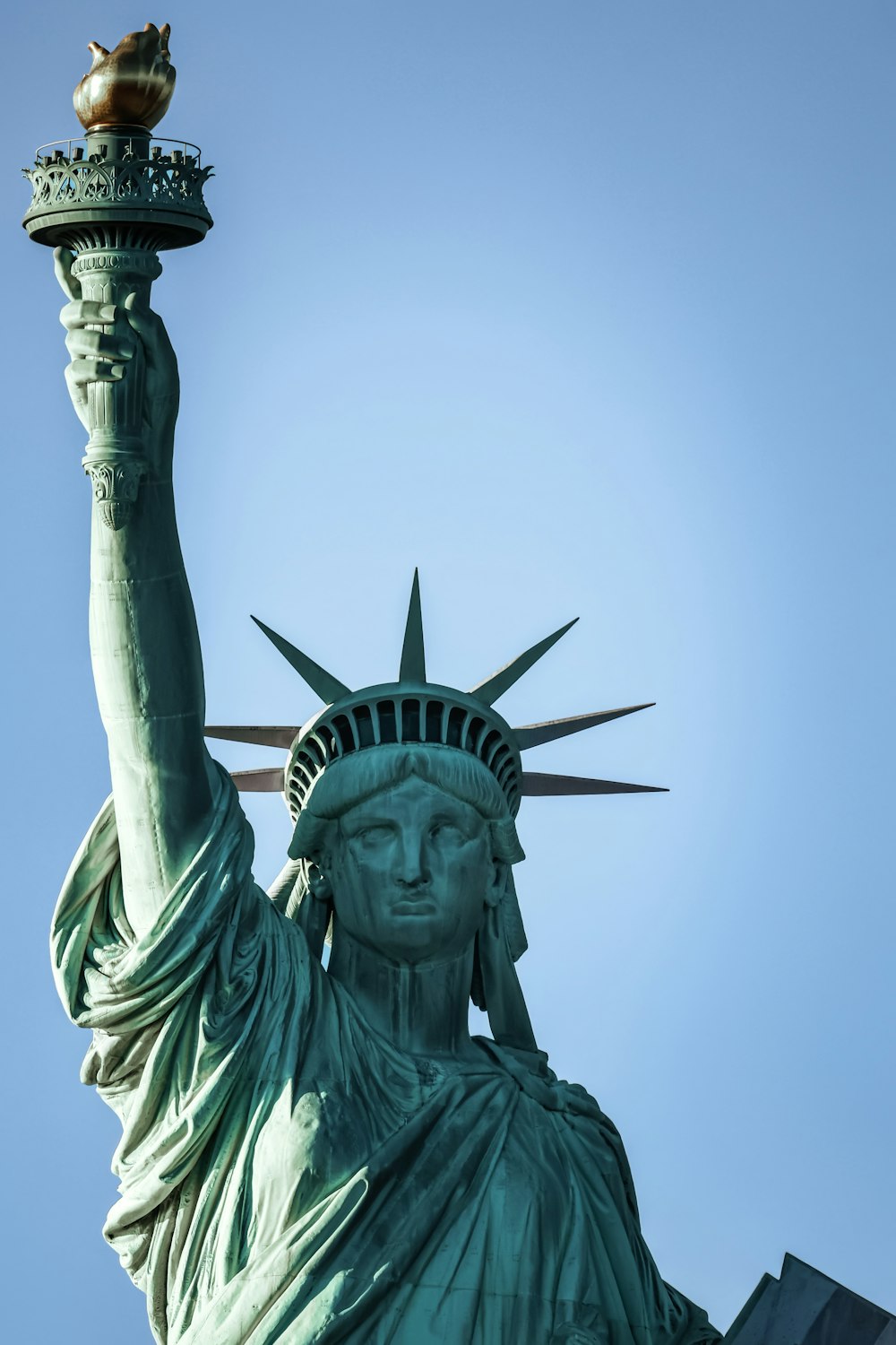 the statue of liberty is holding the torch of liberty