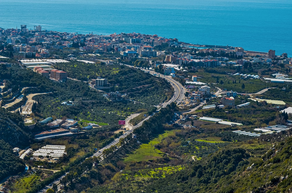 an aerial view of a city and a body of water