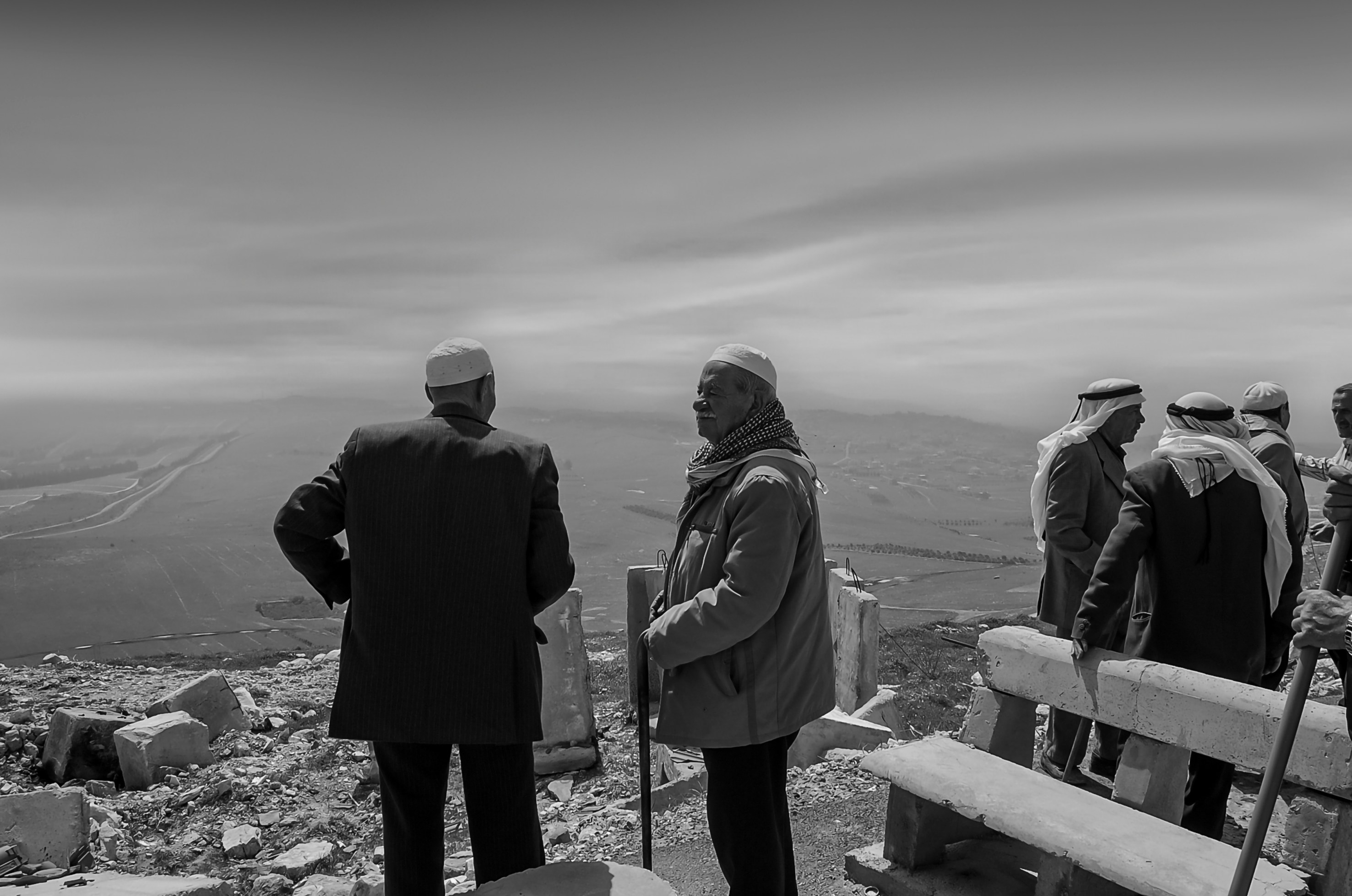 A group of people standing on top of a mountain
