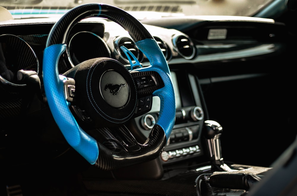 the interior of a car with a steering wheel