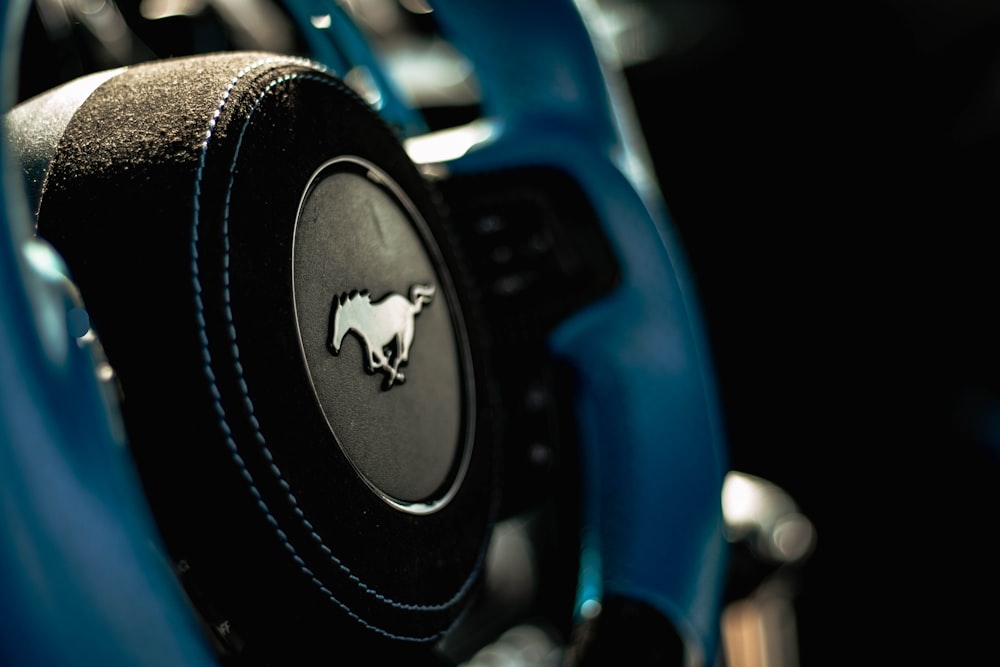 a close up of a steering wheel on a car