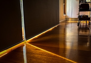a wooden floor with a light shining on it