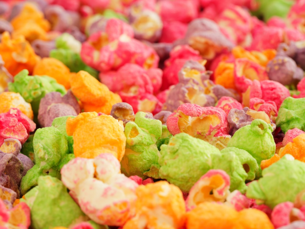 a close up of a pile of colorful popcorn