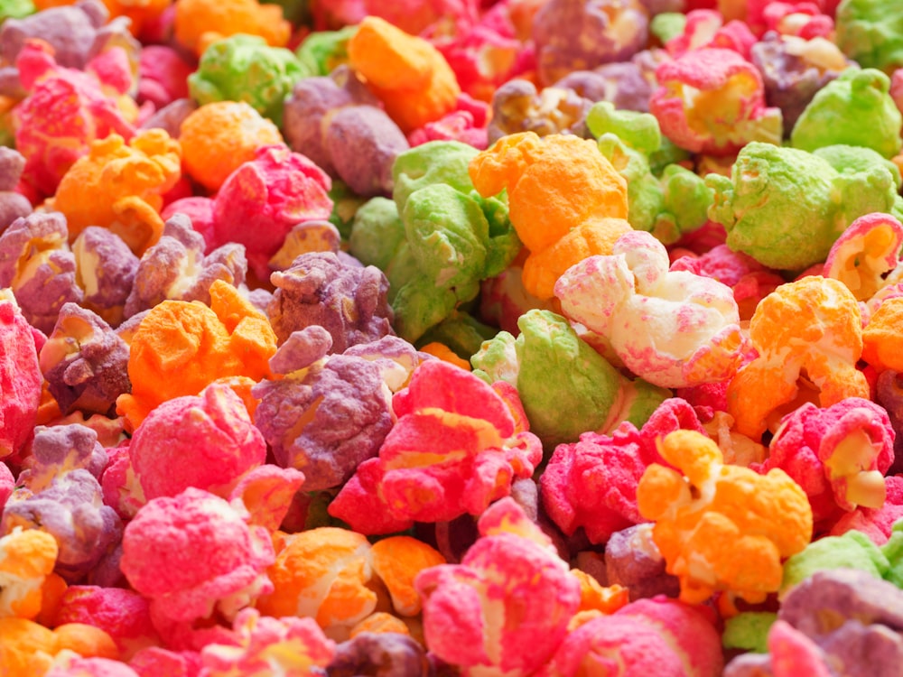 a close up of a mixture of colored popcorn