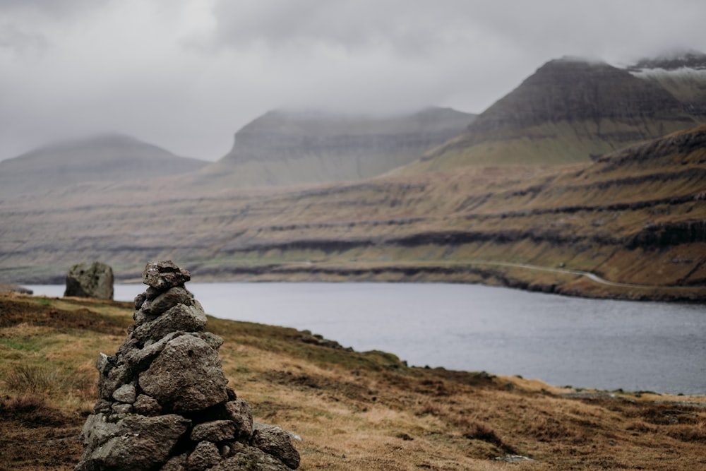 a pile of rocks sitting on the side of a mountain