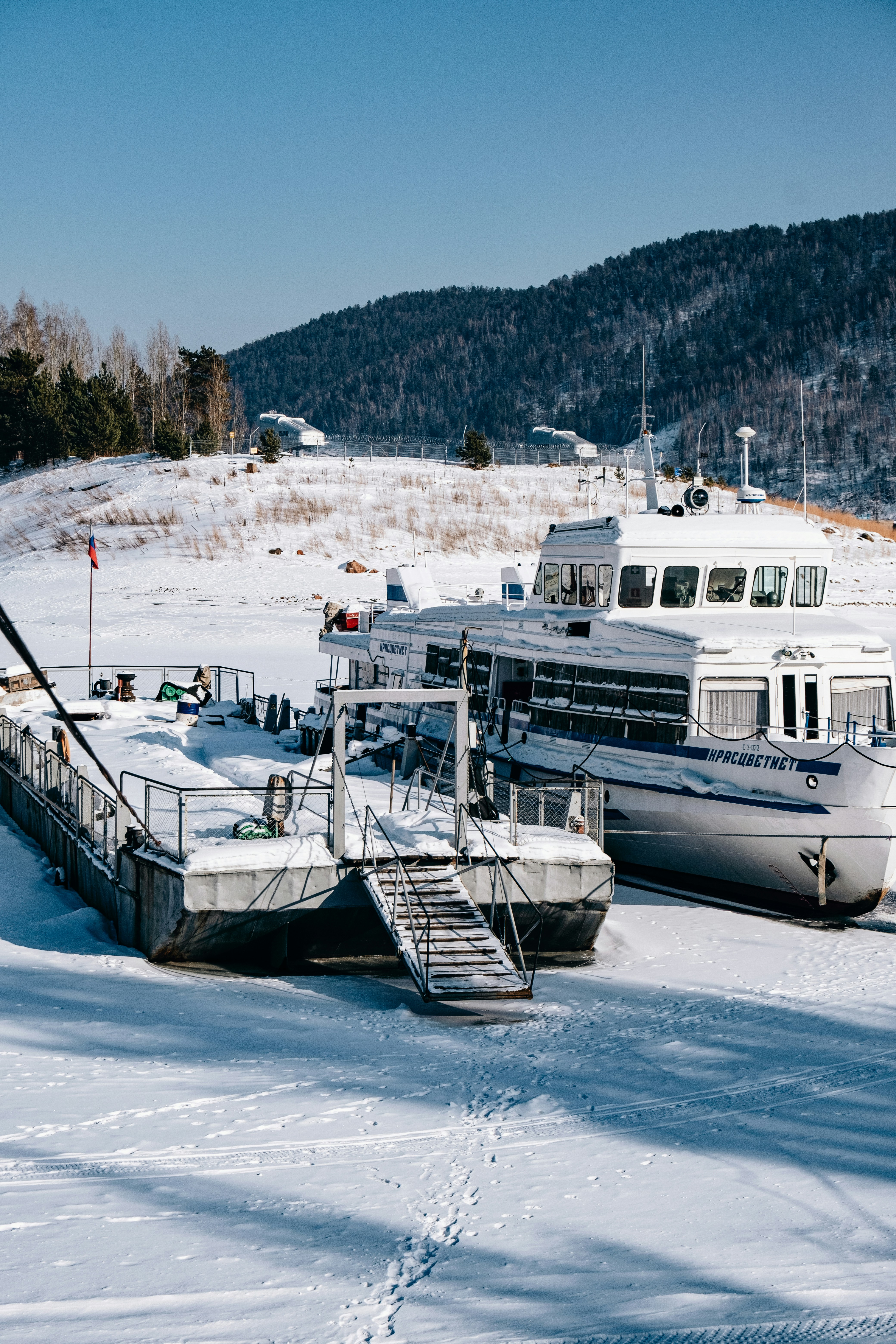 a couple of boats that are sitting in the snow