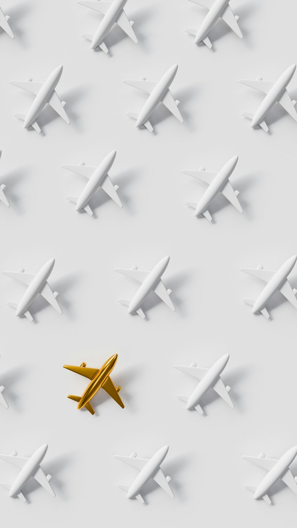a yellow airplane is in the middle of a group of white planes