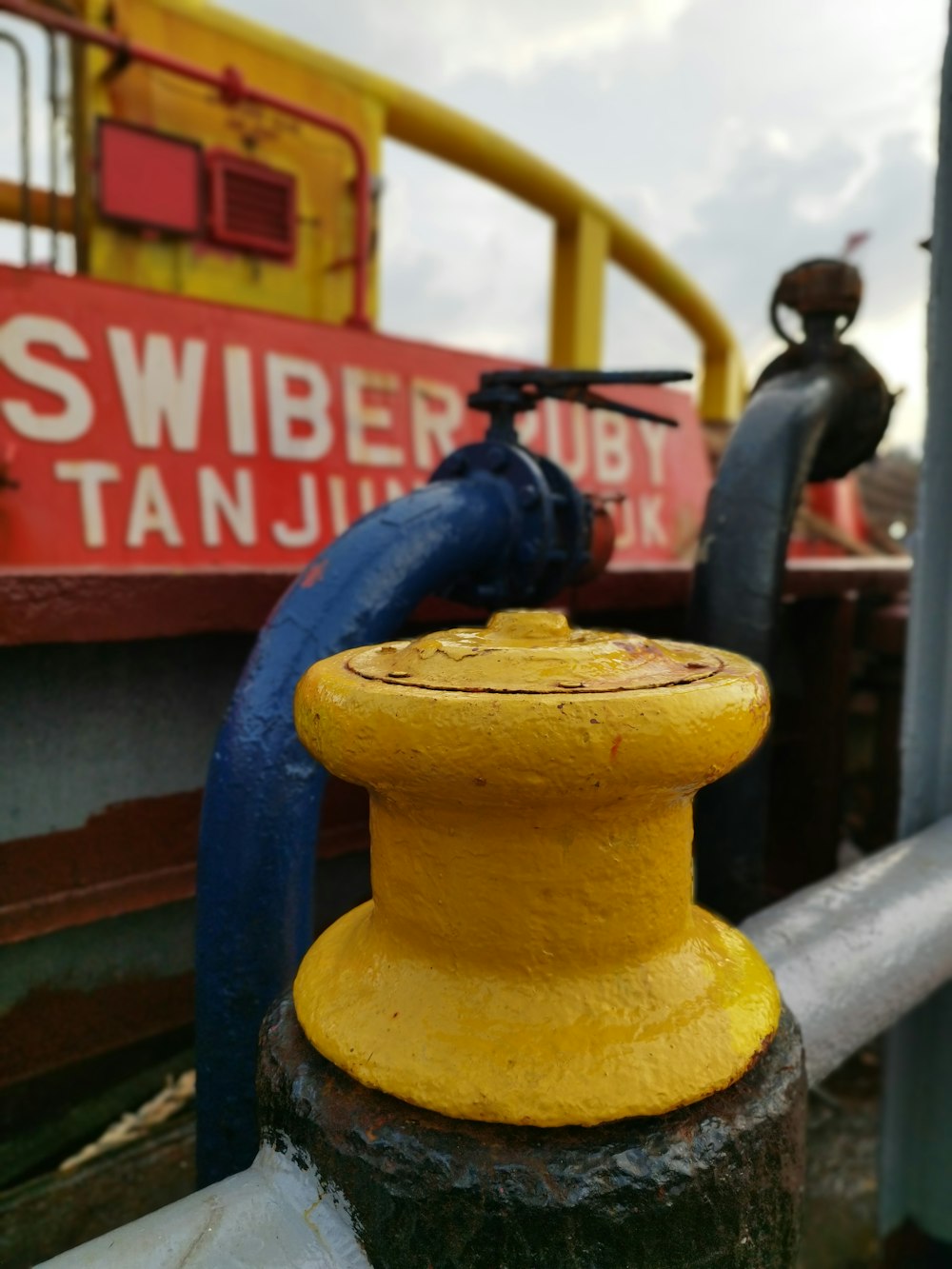 a close up of a yellow and blue pipe