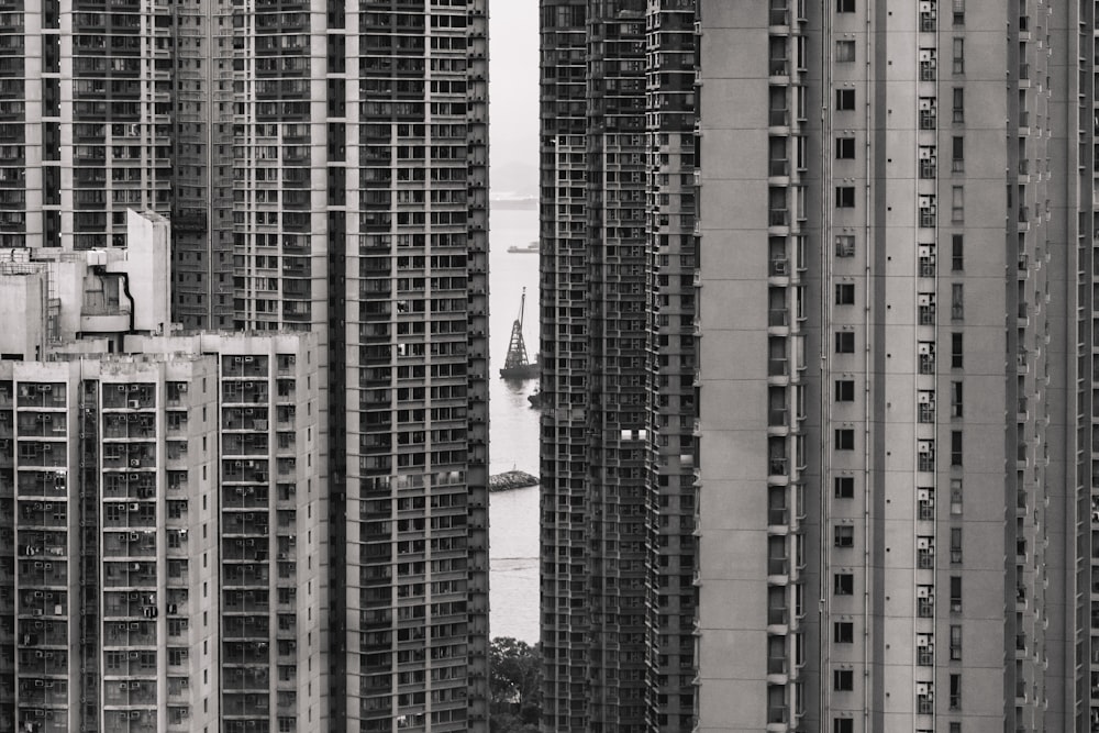 a black and white photo of tall buildings