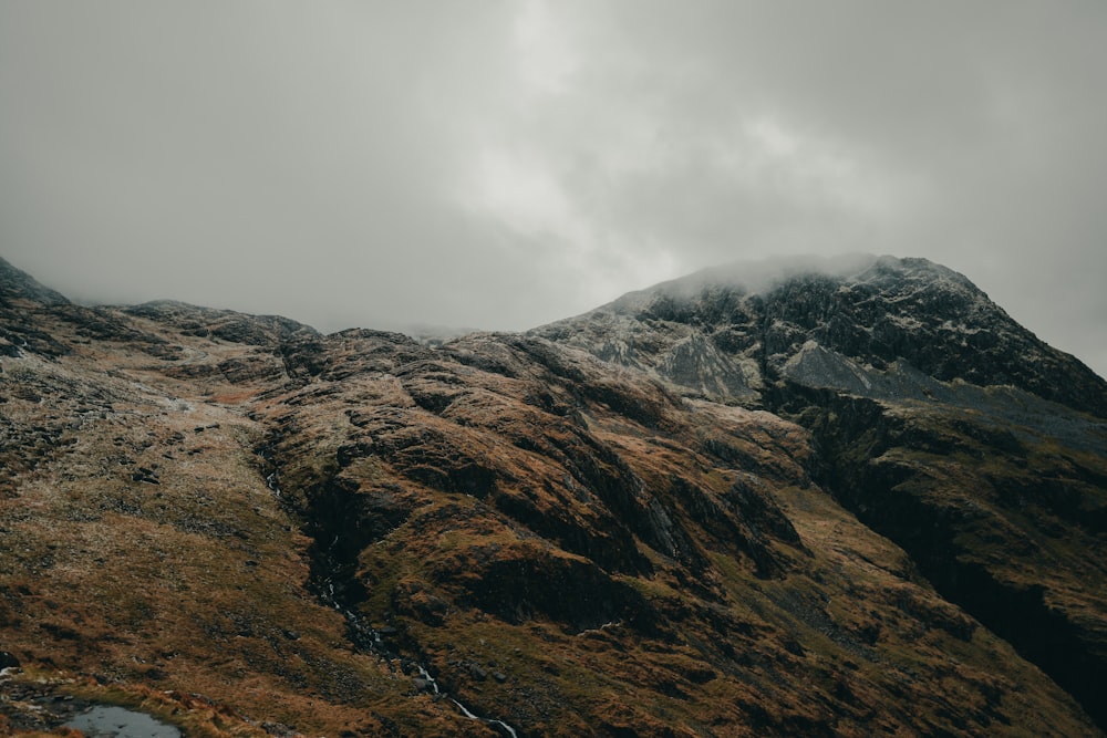 a very tall mountain covered in lots of grass