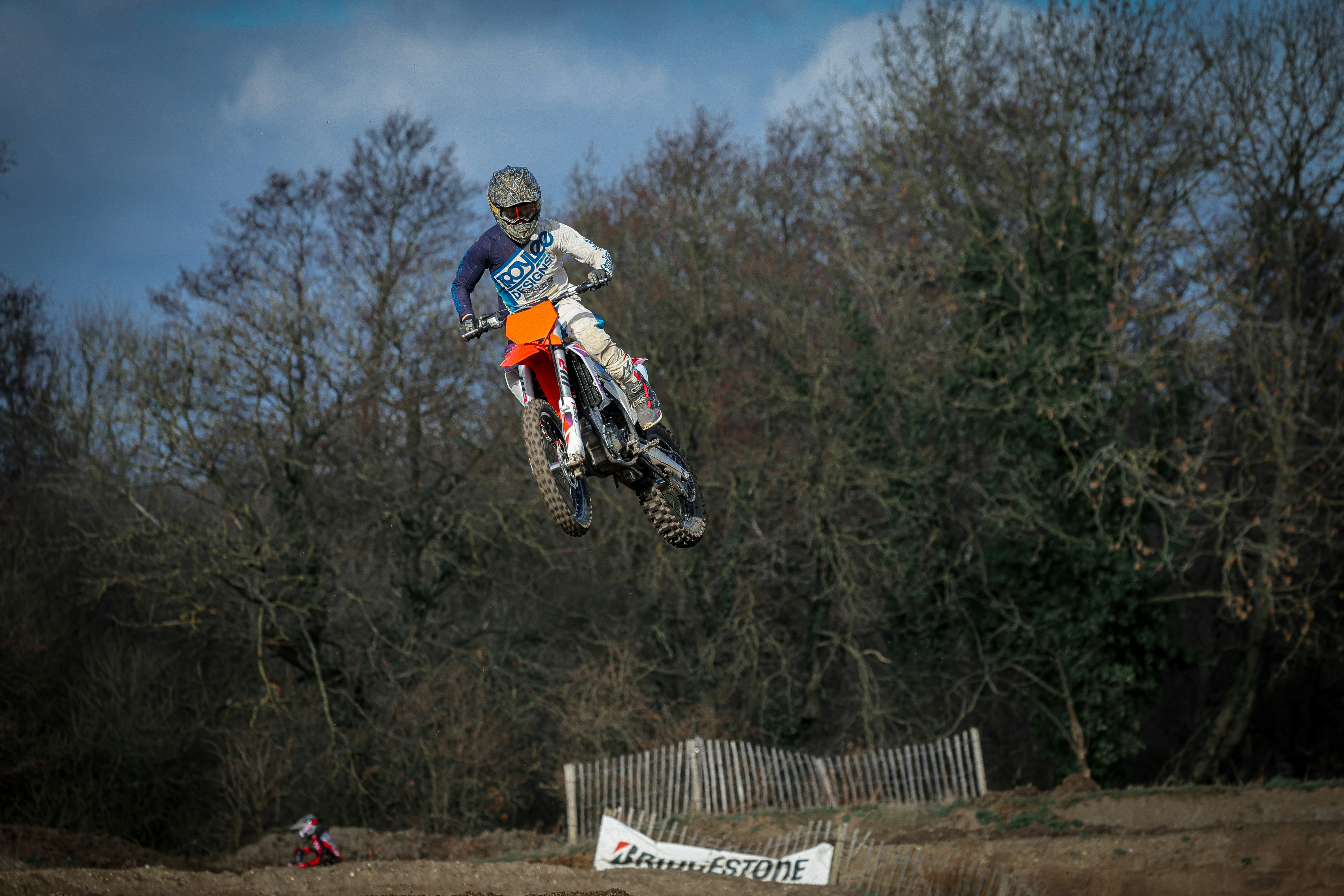a person on a dirt bike jumping in the air