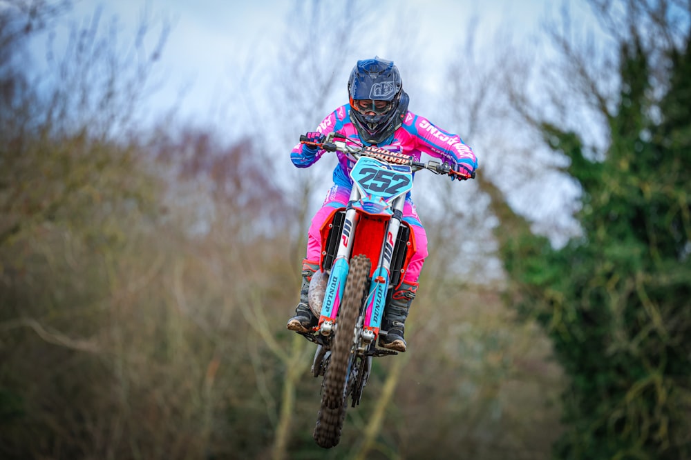 a person on a dirt bike in the air