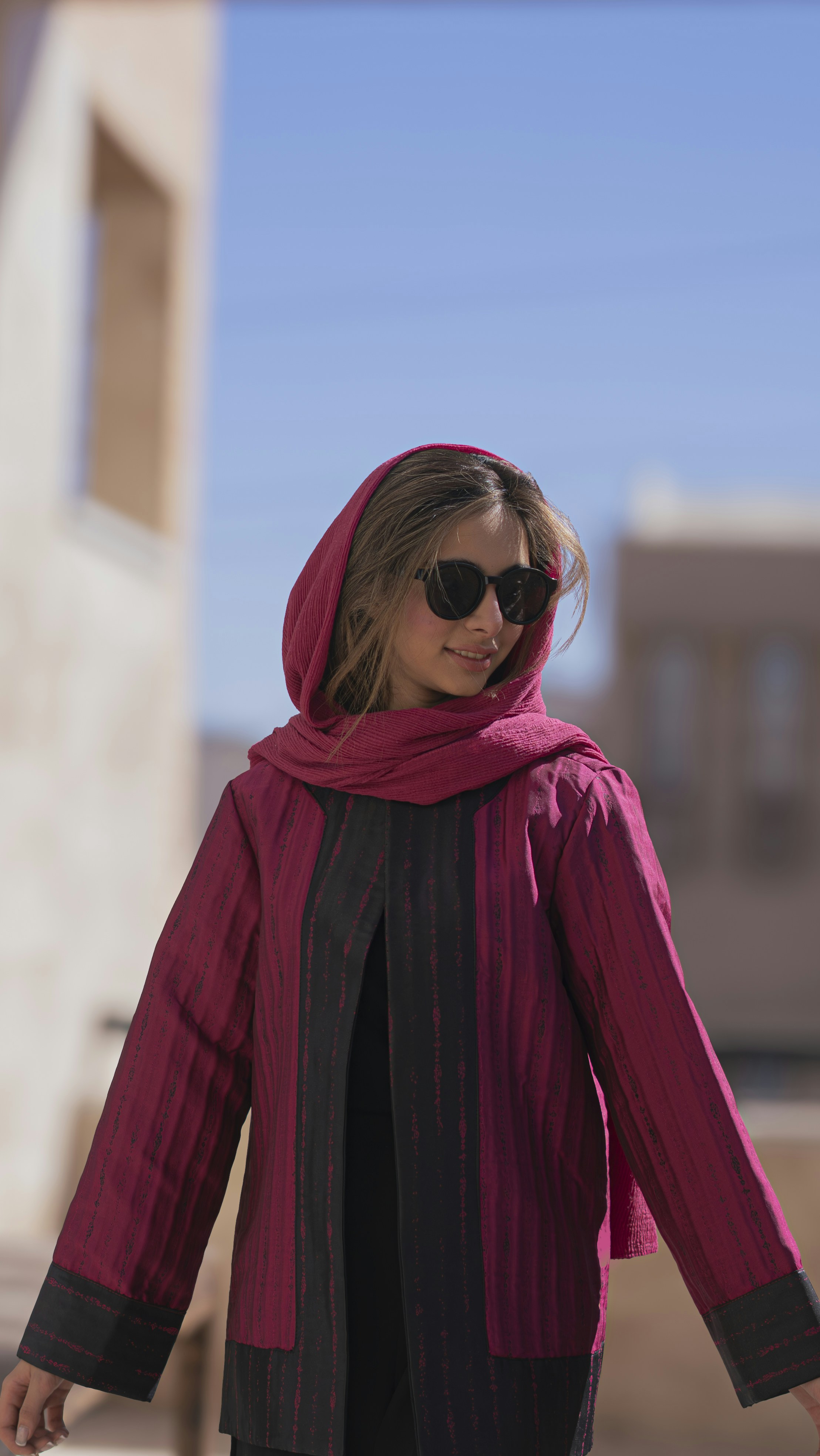 a-woman-wearing-sunglasses-and-a-pink-scarf-photo-free-blue-image-on