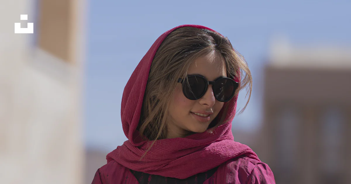 A Woman Wearing Sunglasses And A Pink Scarf Photo Free Blue Image On a-woman-wearing-sunglasses-and-a-pink-scarf-photo-free-blue-image-on