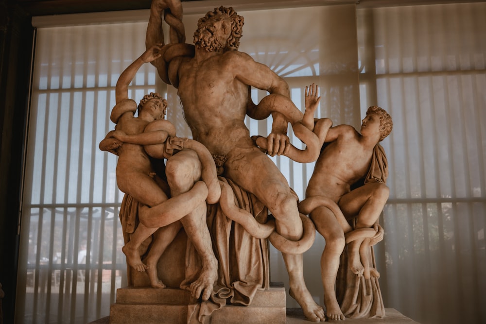 a statue of a man surrounded by other statues