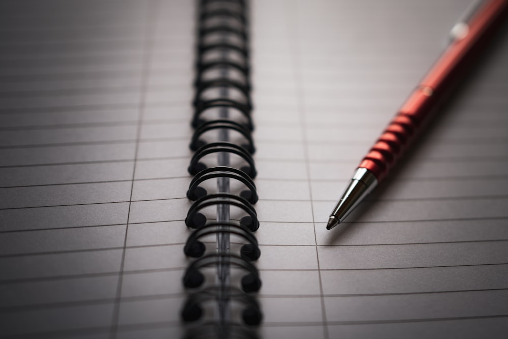 a pen sitting on top of a piece of paper